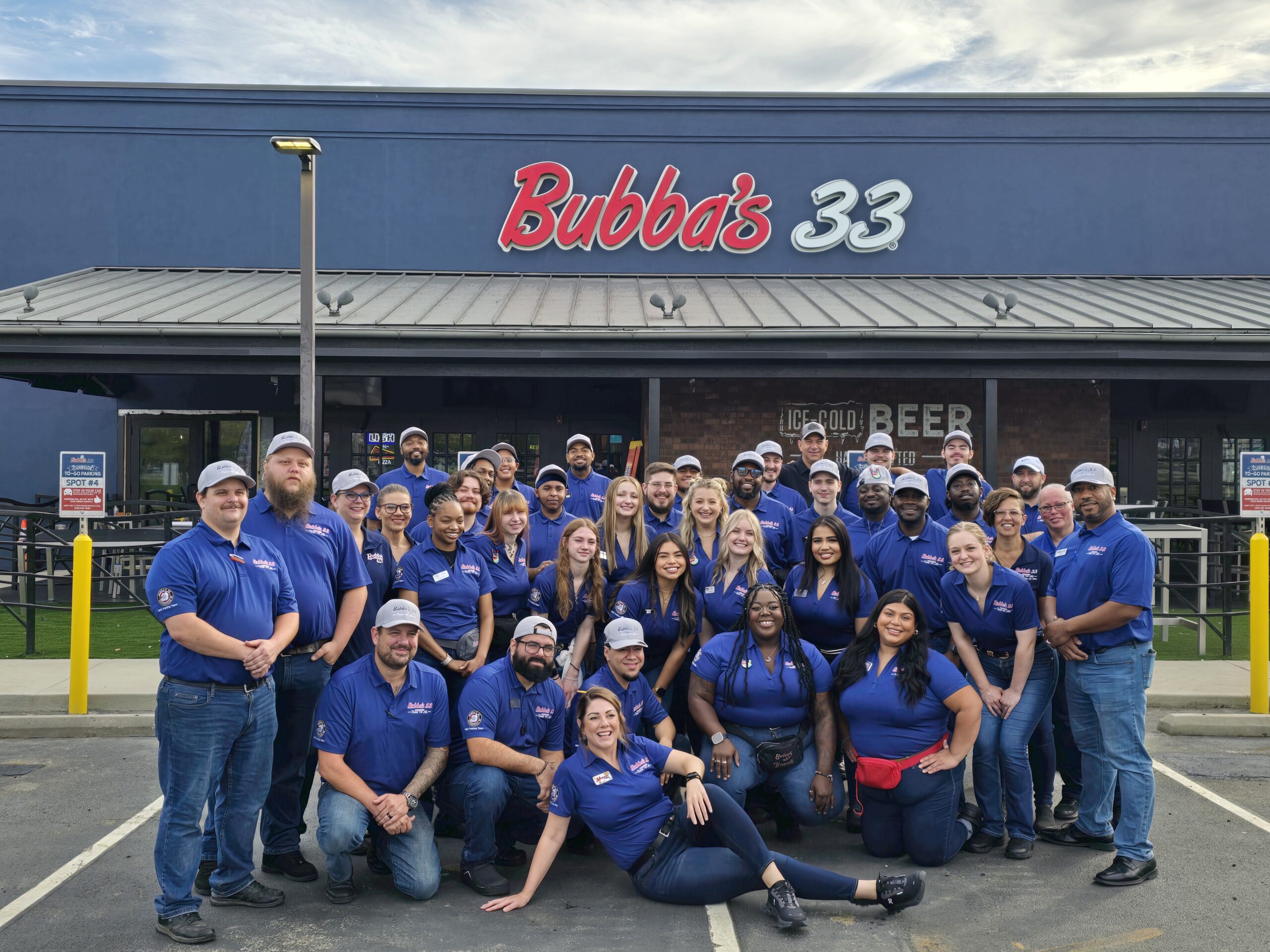 The new Bubba’s 33 team in Jacksonville, NC stands proudly in front of their freshly converted restaurant, formerly a Buffalo Wild Wings.