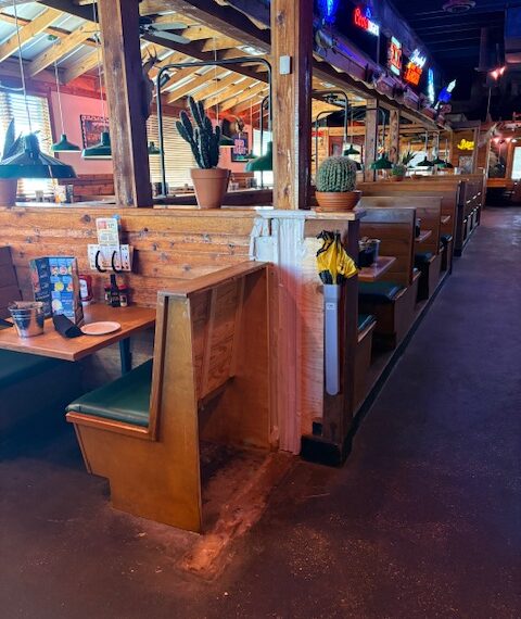 Interior of Texas Roadhouse Lafayette, LA during front-of-house remodel with booths, bar area, and seating layout updated for ADA accessibility.