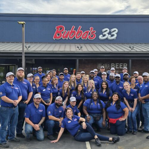 Team photo in front of the completed Bubba’s 33 Jacksonville, NC—a renovated Buffalo Wild Wings now transformed into a full-service restaurant.