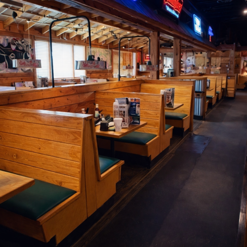 Texas Roadhouse Pelham, AL dining room conversion with reconfigured booths, new bar top installation, and updated seating layout.