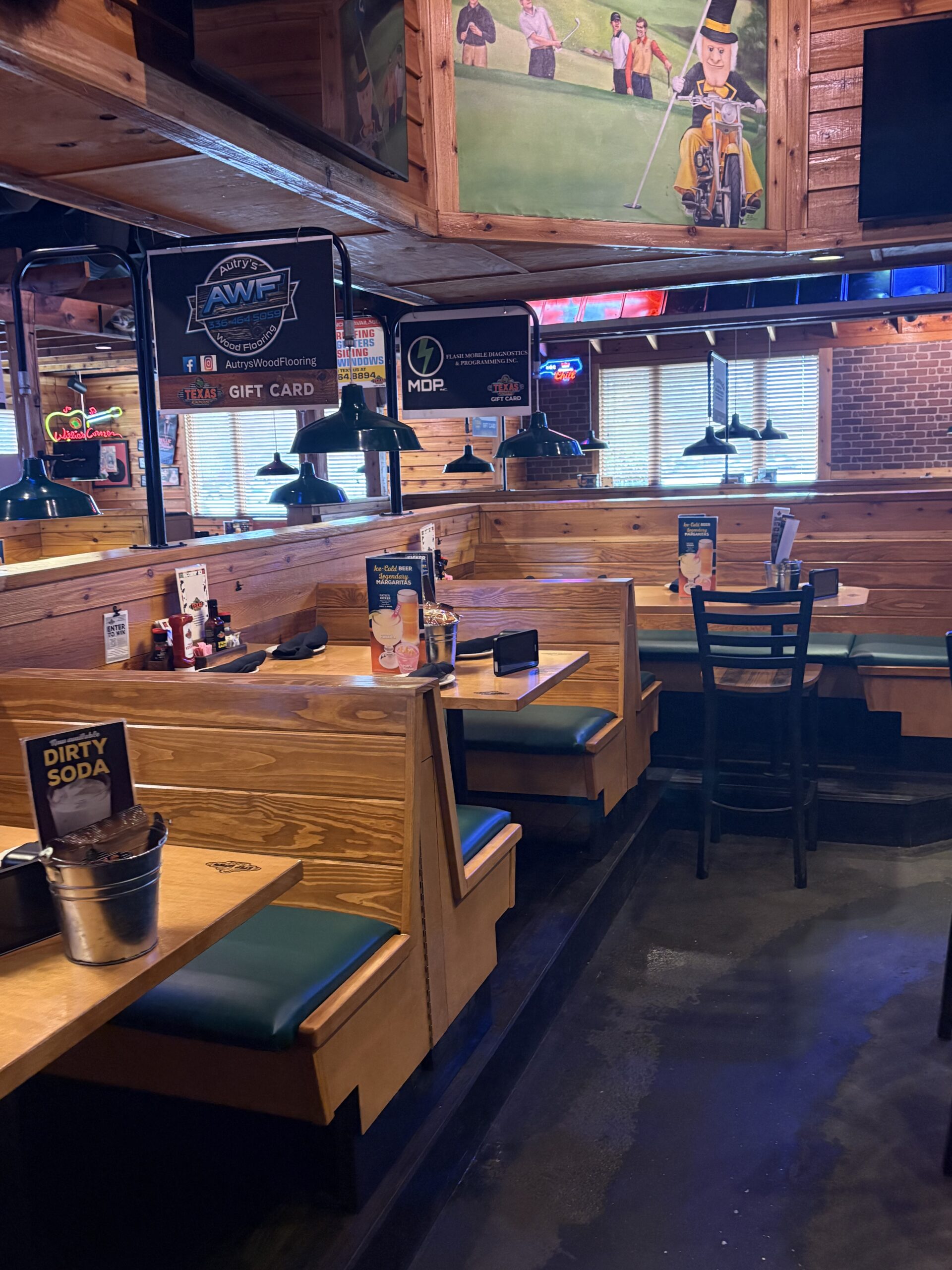 Completed Texas Roadhouse full FOH remodel in Winston-Salem, NC by VMC Facilities featuring updated seating, lighting, bar and interior finishes.