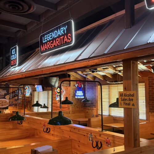 Completed Texas Roadhouse interior and exterior renovation in North Charleston, South Carolina, featuring new cedar, siding, metal roofing, tin, flooring and updated architectural finishes.