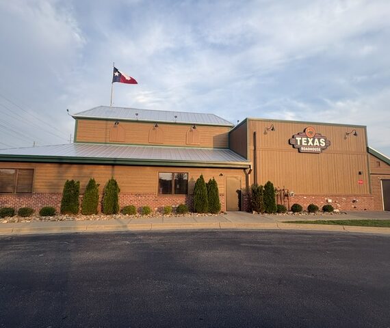 Exterior view of a Texas Roadhouse restaurant in Middletown, Kentucky during and after exterior renovation work featuring new siding, roofing, lighting, doors, and signage upgrades.