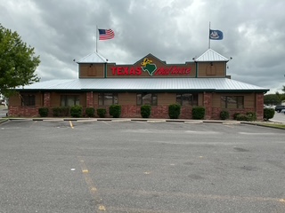 Completed Texas Roadhouse exterior remodel in Lafayette, Louisiana featuring new siding, roofing improvements, upgraded lighting, and refreshed exterior finishes.