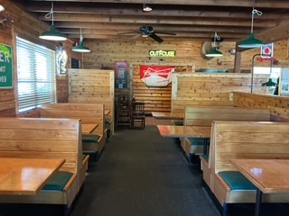 Completed Texas Roadhouse full FOH remodel in Winston-Salem, NC by VMC Facilities featuring updated seating, lighting, bar and interior finishes.